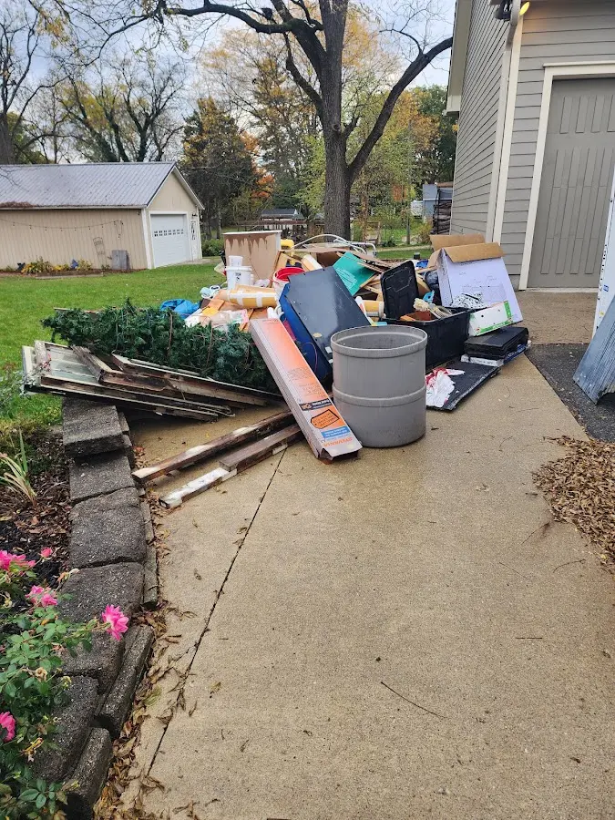 Dumpster being loaded with debris for 30 Yard Dumpster Rental in Waikele